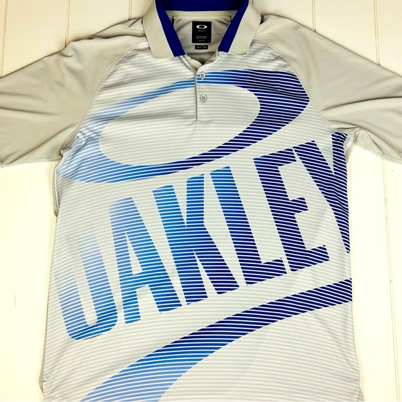 ⛳️ Mens Oakley Big Graphic Print Blue and Silver Golf Polo Shirt - Picture 1 of 6